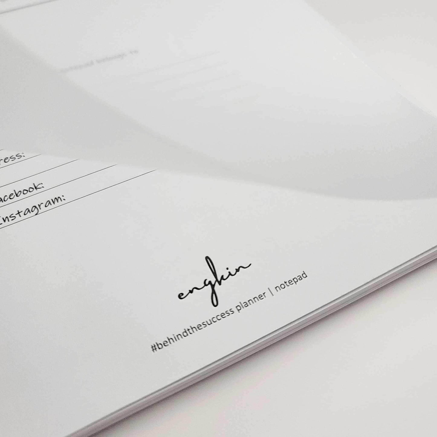 Close-up of undated productivity life planner pages with sections for address, Facebook, and Instagram.