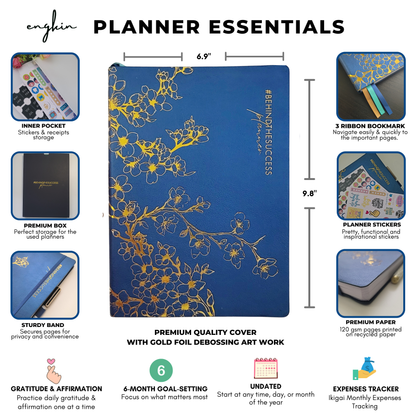 Blue productivity planner with gold floral debossing, ribbon bookmarks, stickers, and expense tracker features.