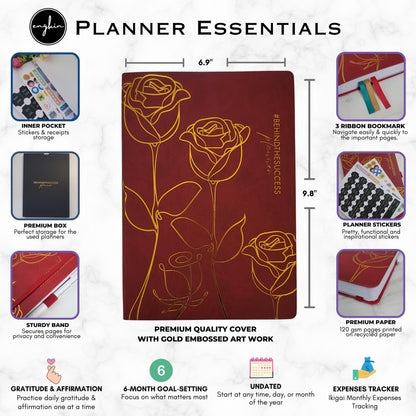 Undated productivity planner with gold embossed floral cover, stickers, bookmarks, and inner pocket.
